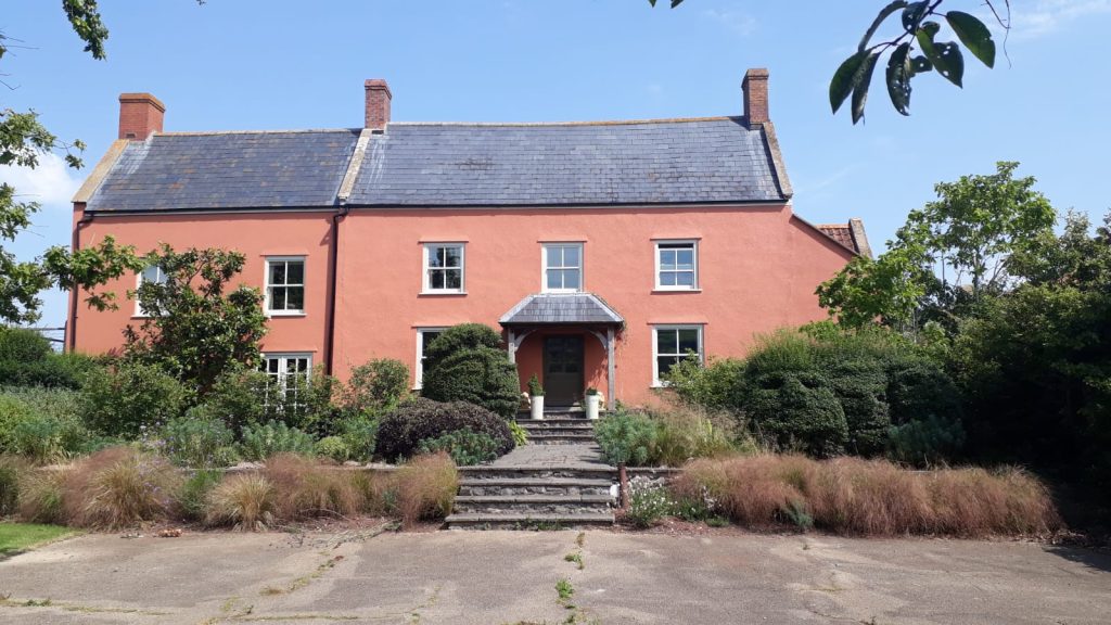 Exterior of Yoe Valley HQ, painted Barbara's Pink from the Original Collection in Masonry Finish